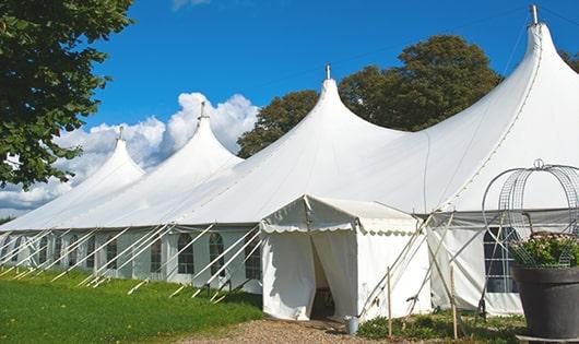 a group of luxury portable restrooms with individual stalls and running water in Macedon